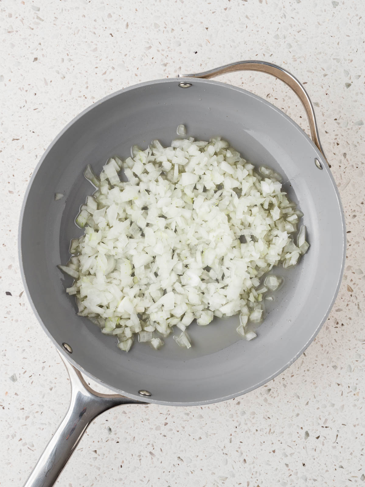 Diced onions in a saute pan.