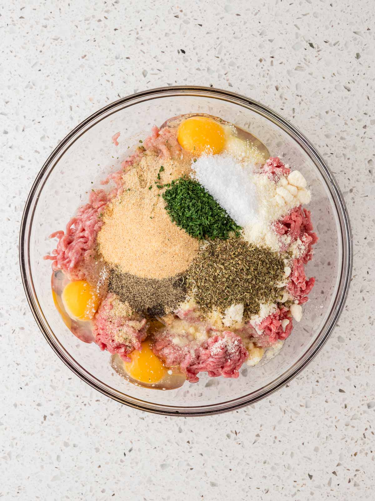 Purified water, olive oil, granulated garlic, dried parsley flakes, Italian seasoning, kosher salt, and ground black pepper added the mixture.