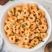 Cheese tortellini with rose sauce in a serving bowl.
