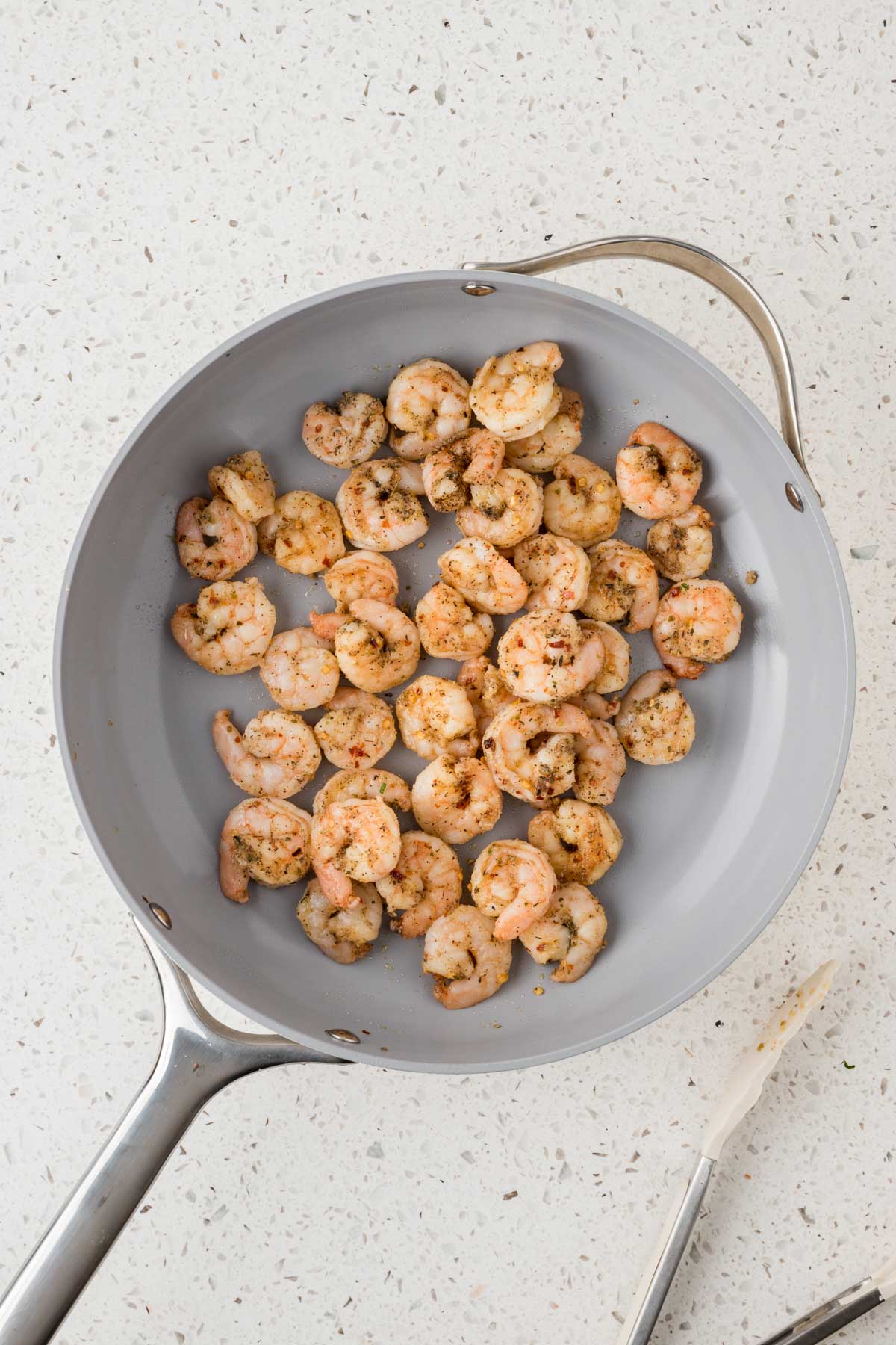 Shrimp sauteed in a pan.