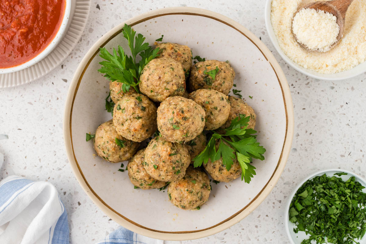 Italian chicken meatballs in a serving bowl.