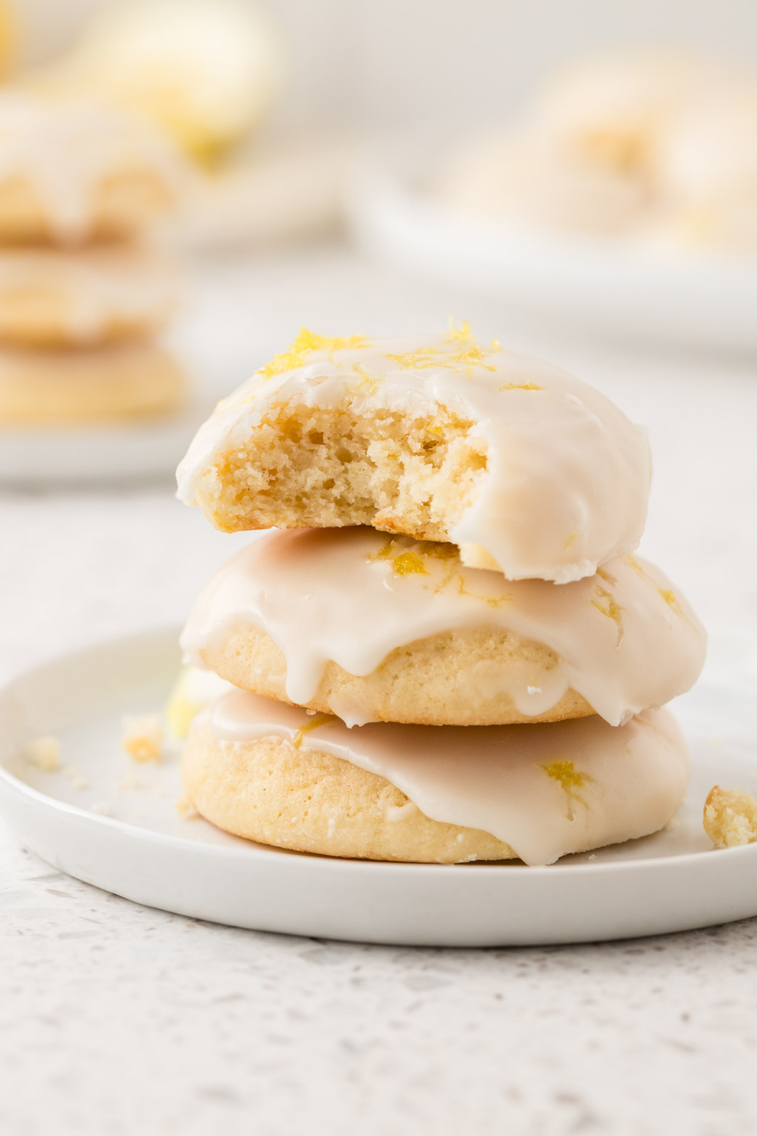 Stack of lemon ricotta cookies on a small plate. 