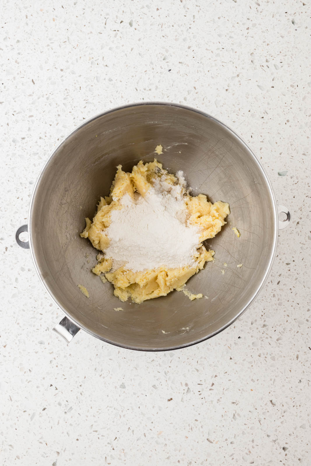 Wet and dry ingredients in a mixing bowl.