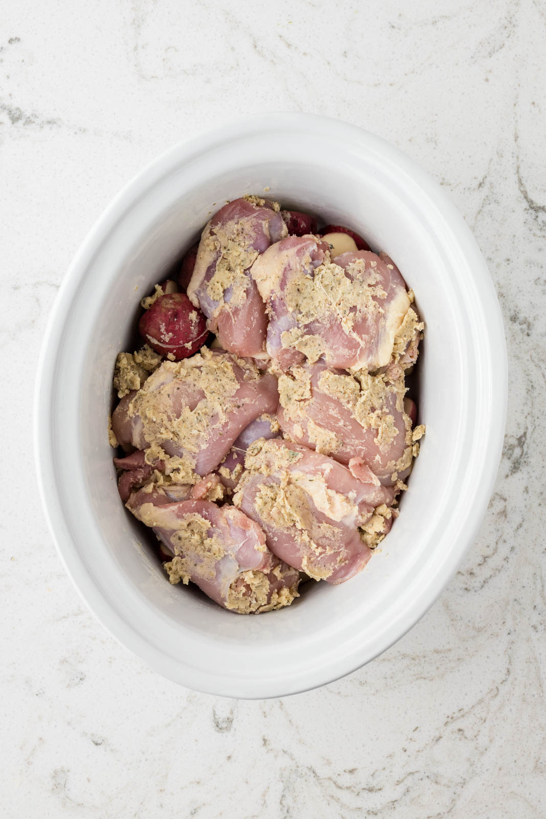 Chicken thighs and potates in crock pot.