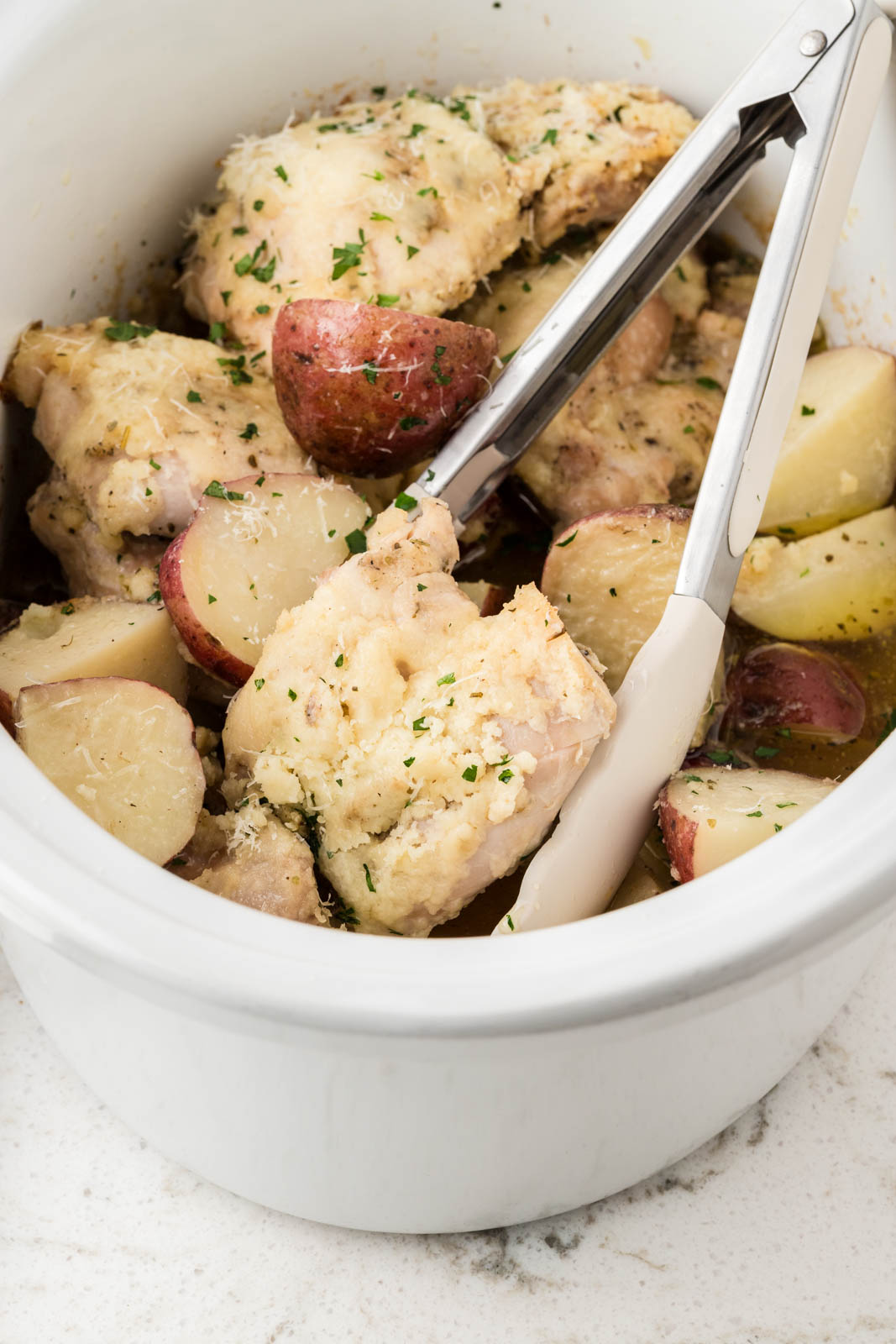 Garlic Parmesan Chicken and Potatoes in a slow cooker.