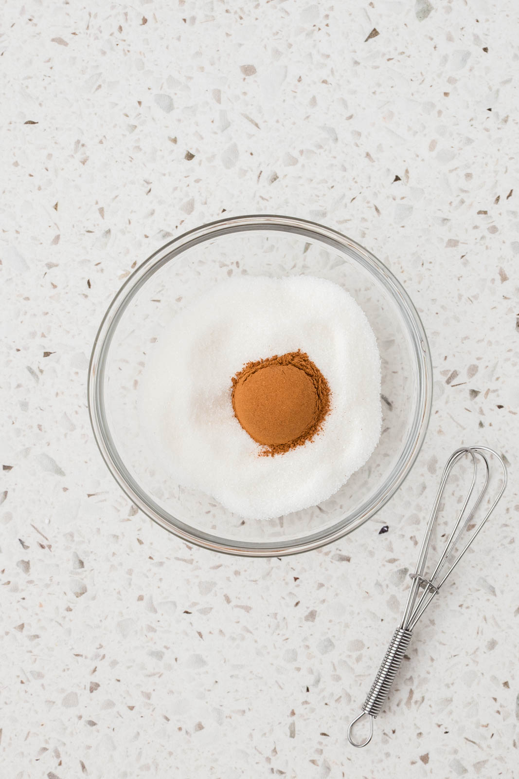Cinnamon and sugar in a small mixing bowl.