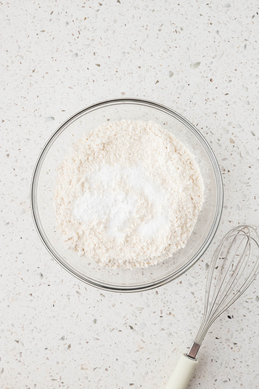 Dry ingredients in mixing bowl for cannoli cookies.
