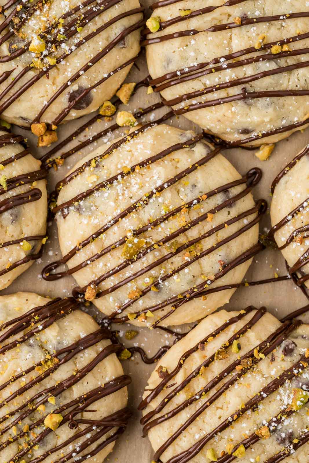 Cannoli cookies on a baking sheet with parchment paper.