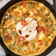 Caprese Frittata in a cast iron skillet.