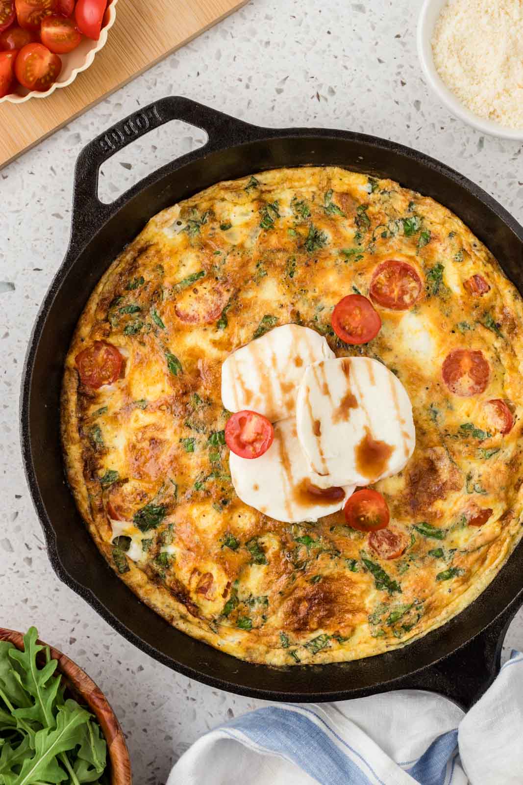 Caprese Frittata in a cast iron pan. 