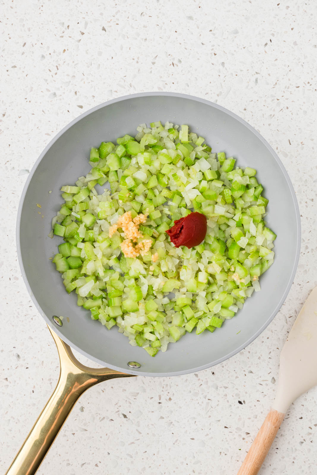 Sauteed celery and onions with tomato paste and garlic.