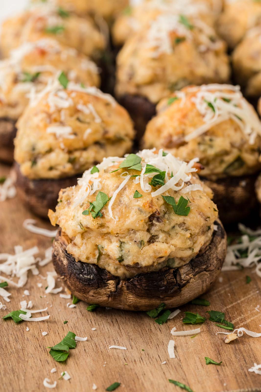 Italian stuffed mushrooms on a wooden board.