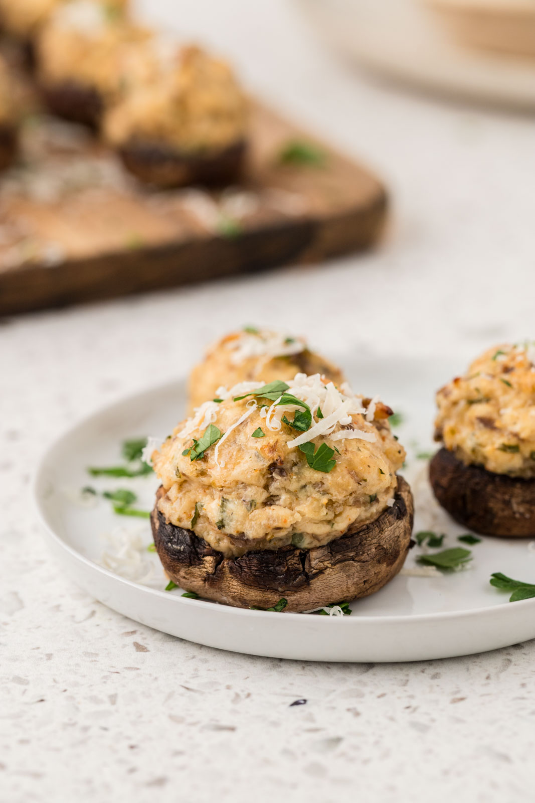 Italian stuffed mushrooms on an appetizer plate.