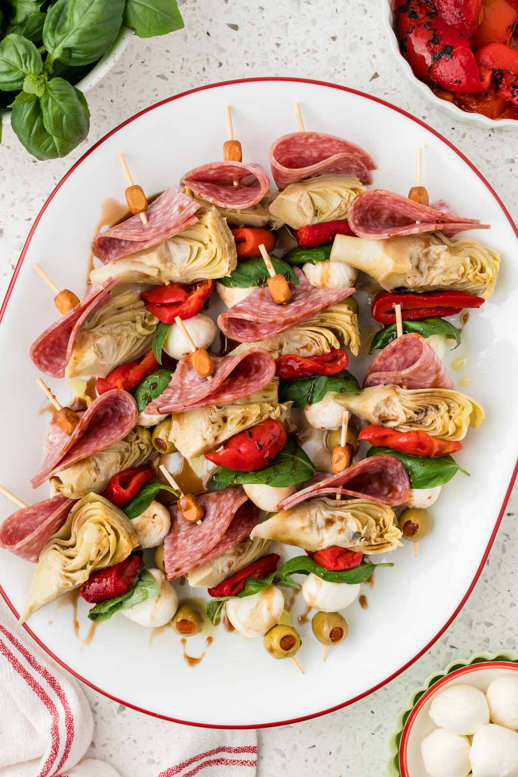 Mini antipasto skewers on a serving platter.
