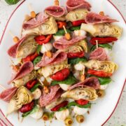 Platter full of mini antipasto skewers.