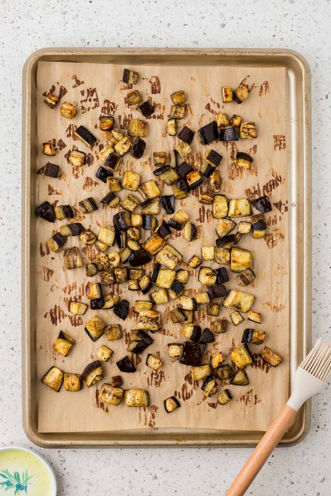 Roasted eggplant on a sheet pan.