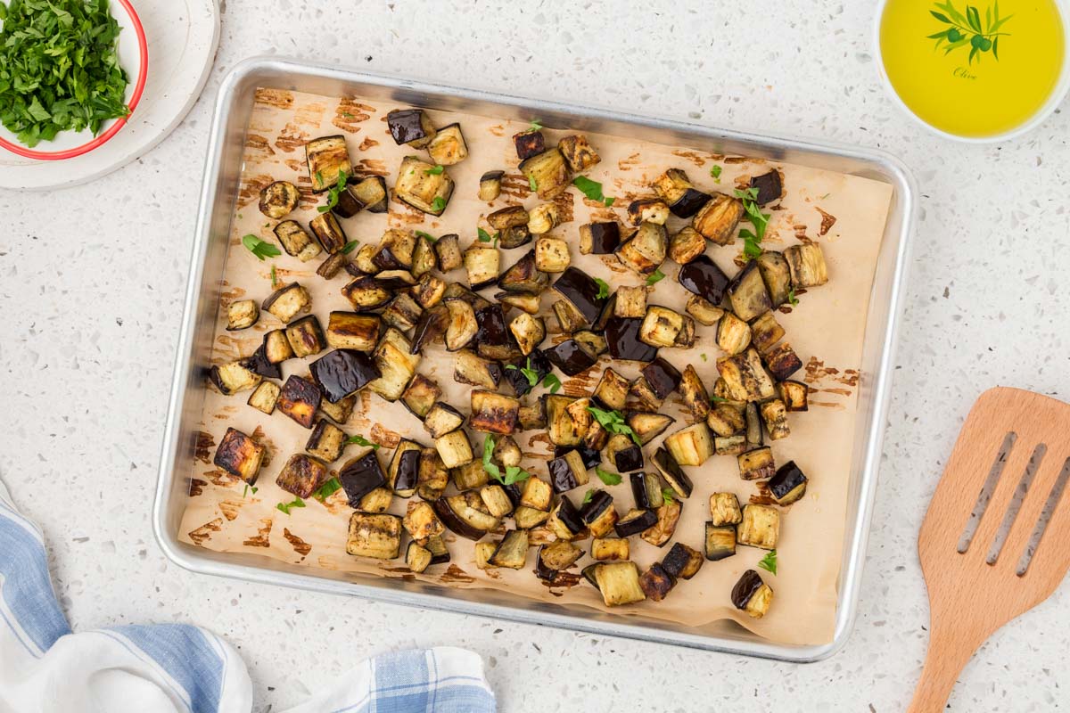 Roasted eggplant on a sheet pan.