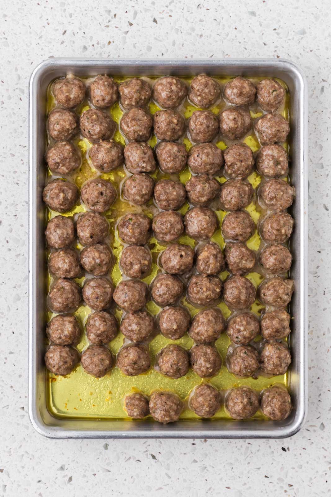 Baked Italian Mini Meatballs on baking sheet.