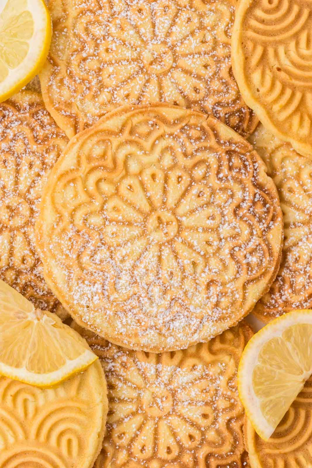 Lemon pizzelle stacked on top of eachother.
