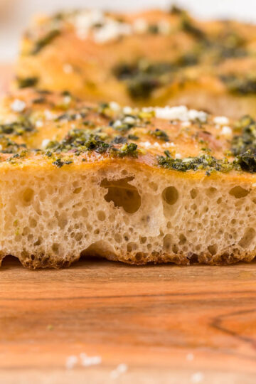 Pesto focaccia on a serving board.
