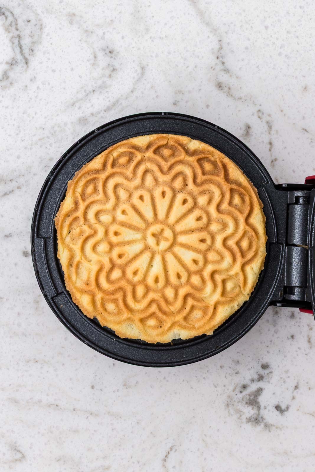 Pizzelle cooked on pizzelle iron.