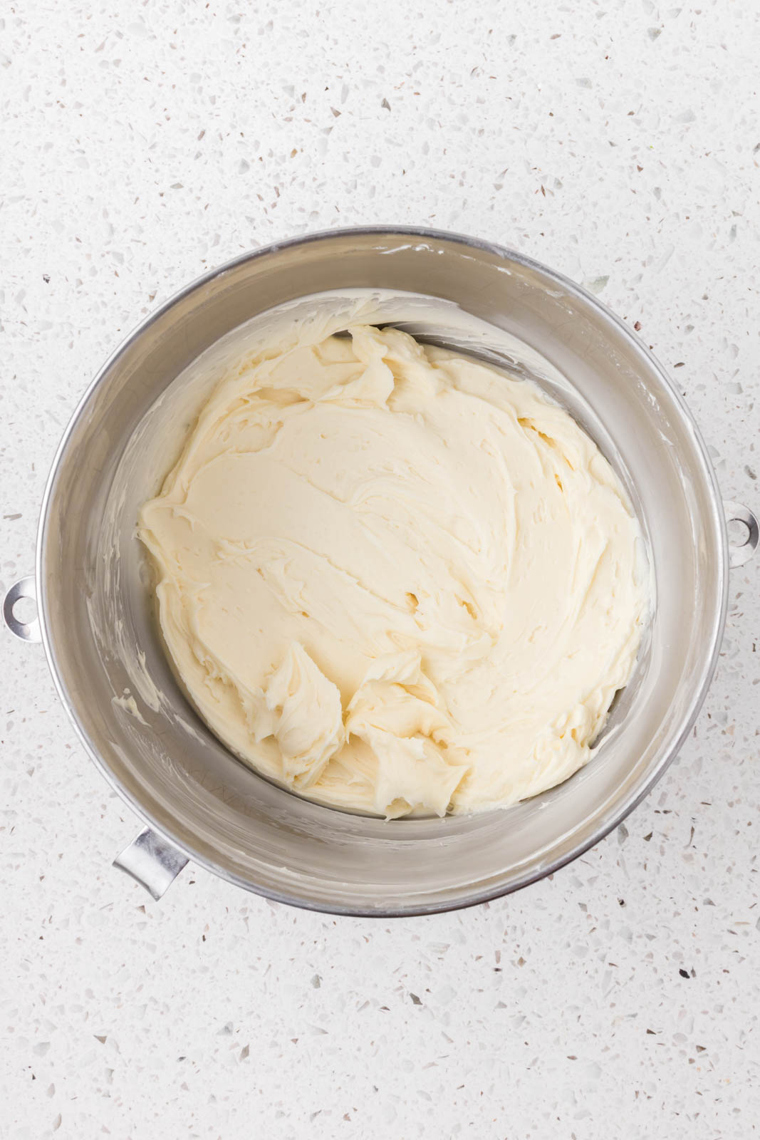 Mascarpone frosting in a mixing bowl.