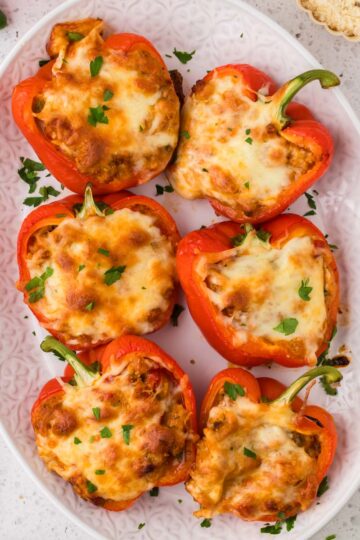 Italian chicken stuffed peppers on a platter.