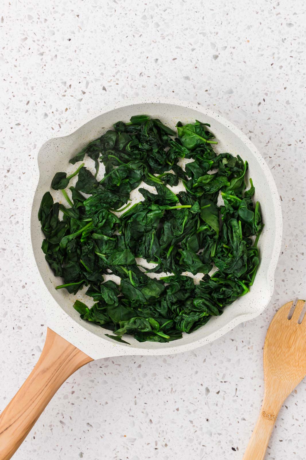 Sauteed spinach in a pan.
