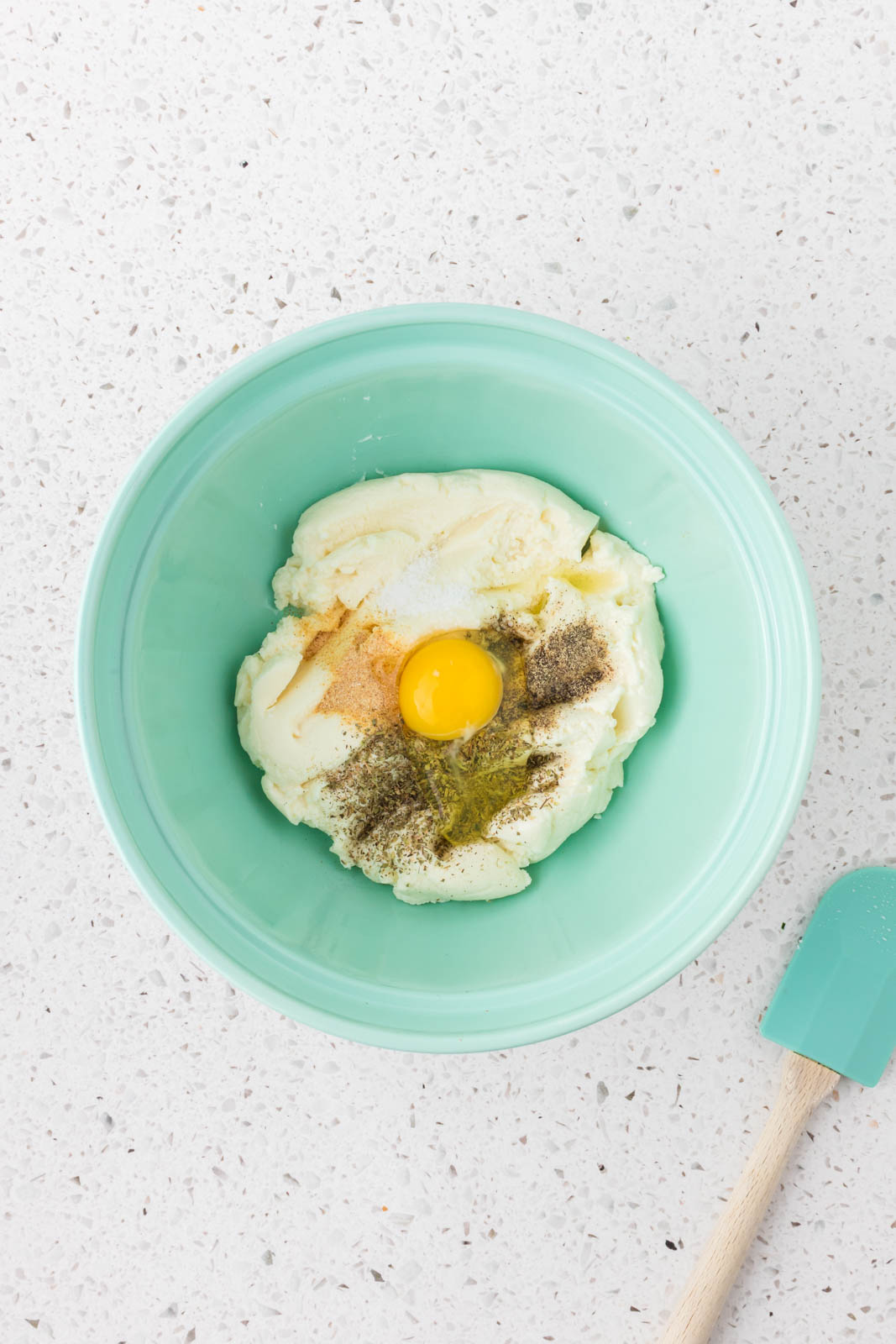 Ricotta, egg, salt, pepper, italian seasoning, garlic powder in a mixing bowl.