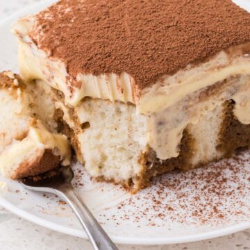 Tiramisu poke cake on a plate.