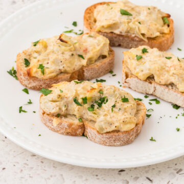 Artichoke Bruschetta on a serving plate.