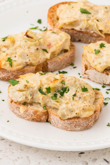 Artichoke Bruschetta on a serving plate.