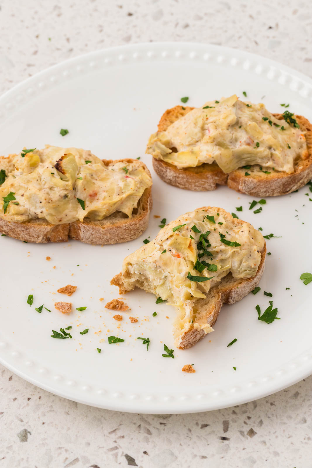 Artichoke Bruschetta on a plate.