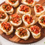Caprese Bruschetta on a serving board.