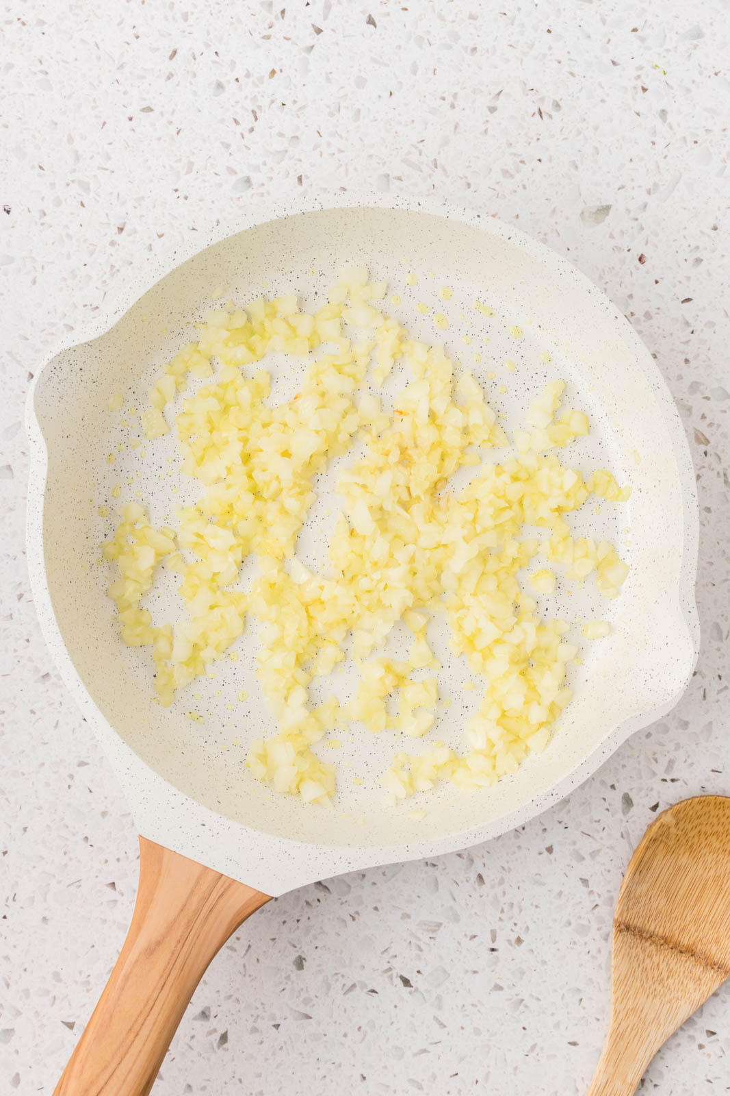 Diced onions in a saute pan. 