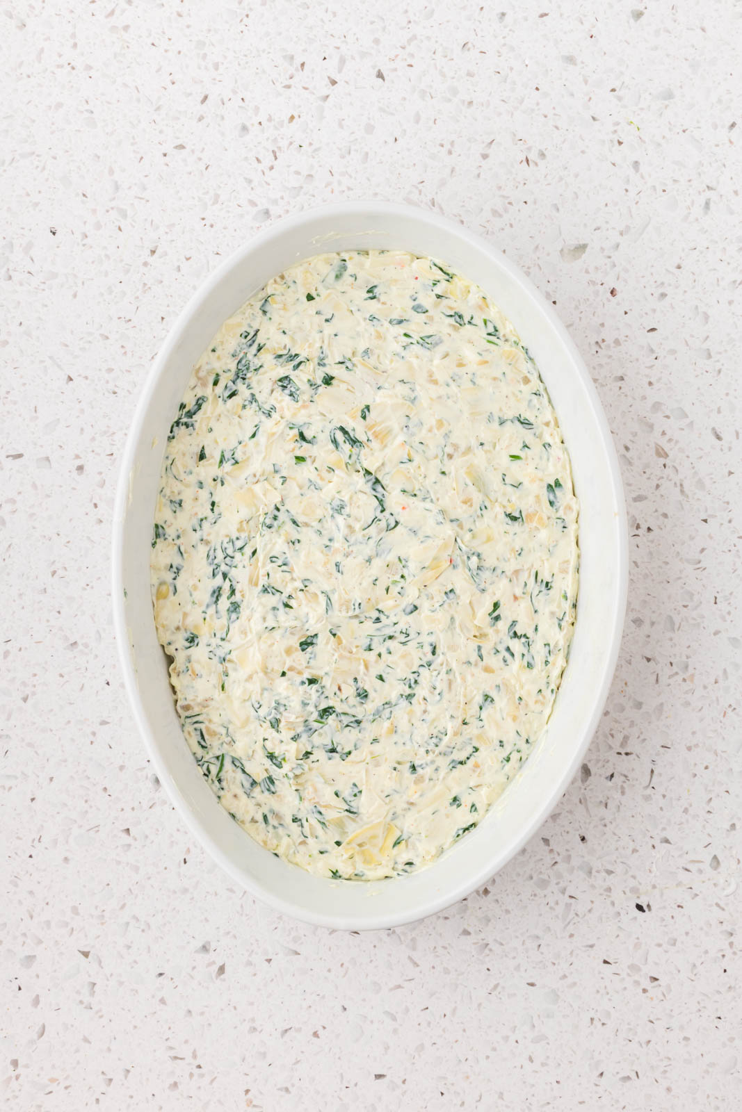 Combined ingredients added to greased casserole dish. 