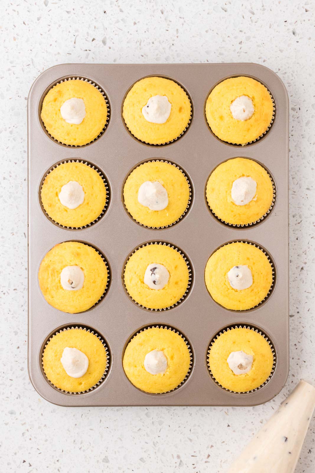 Cannoli cupcakes with filling.