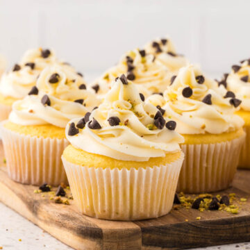 Cannoli Cupcakes on a wooden serving board.
