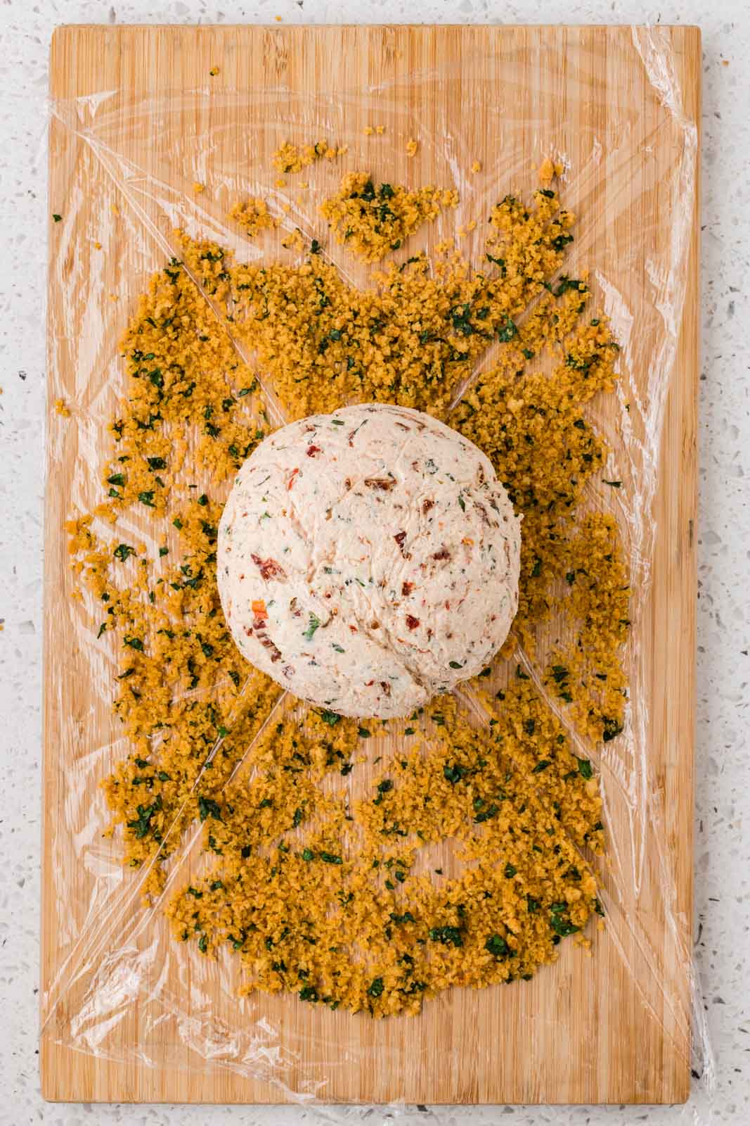 Cheeseball rolled in toasted breadcrumb mixture.