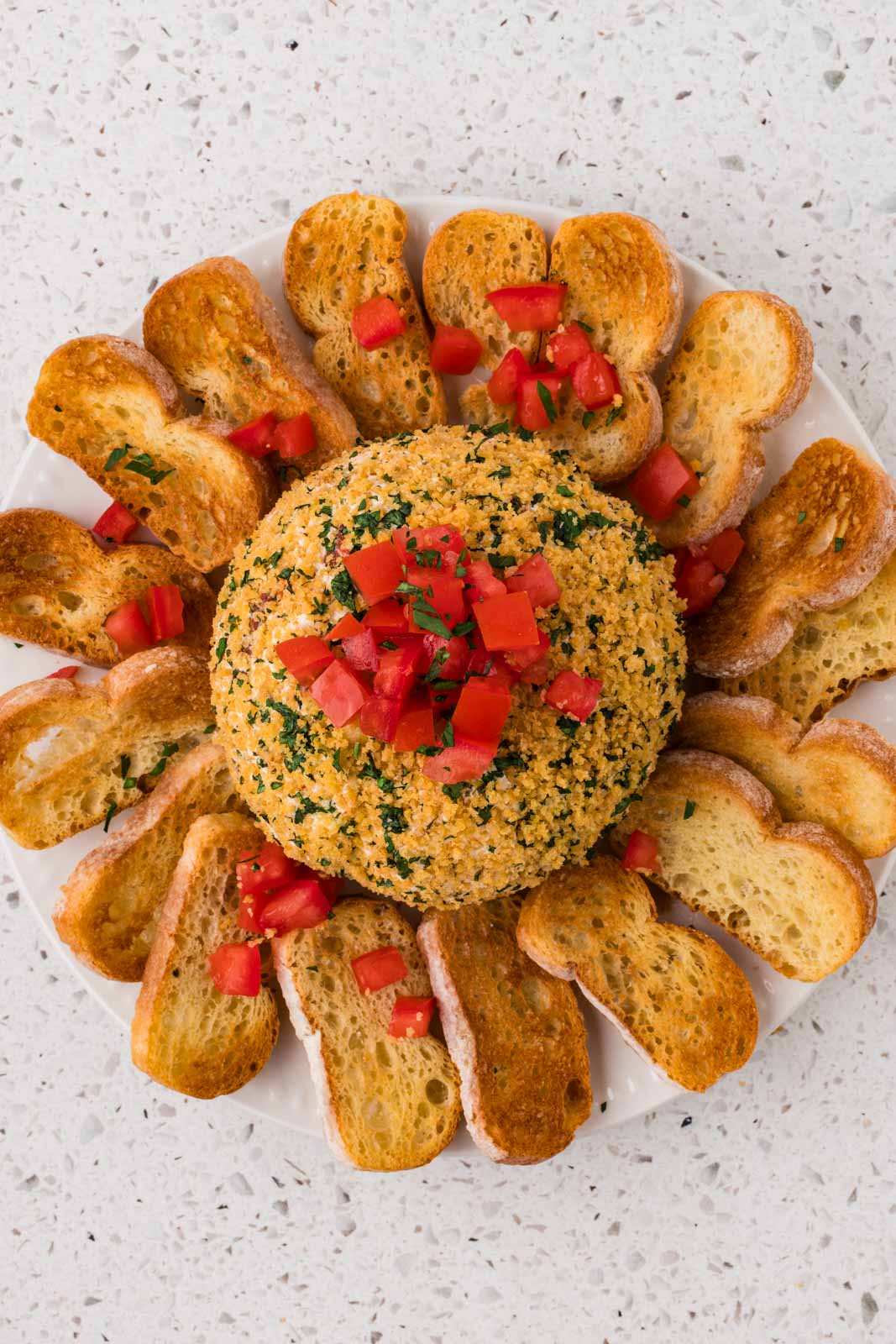 Bruschetta cheeseball on a platter.