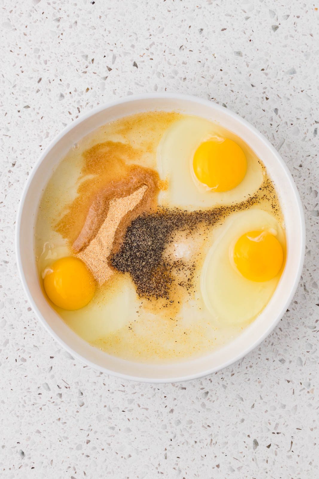 Dipping mixture for the cutlets in a bowl.