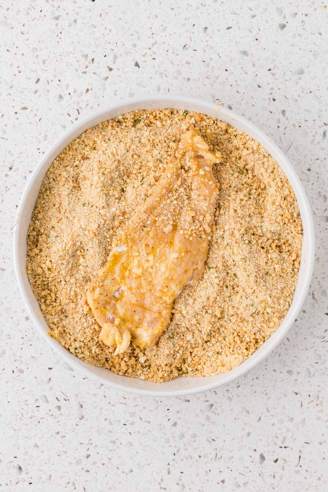 Chicken cutlet dipped in breadcrumb mixture.