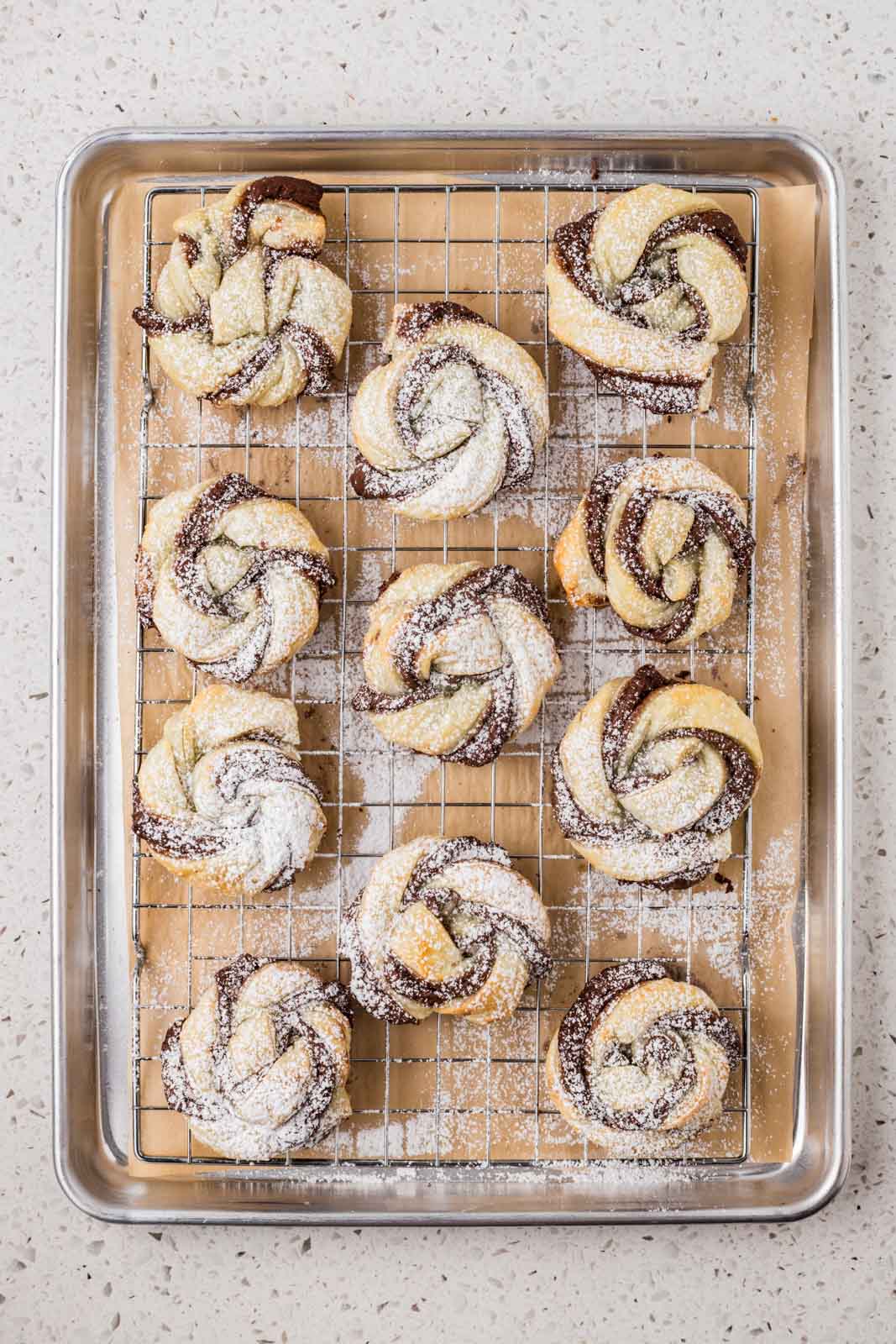 Pastries dusted with powdered sugar. 