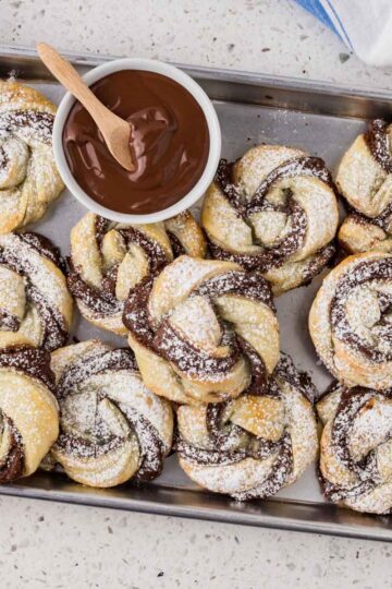 Nutella puff pastry twists on a platter.