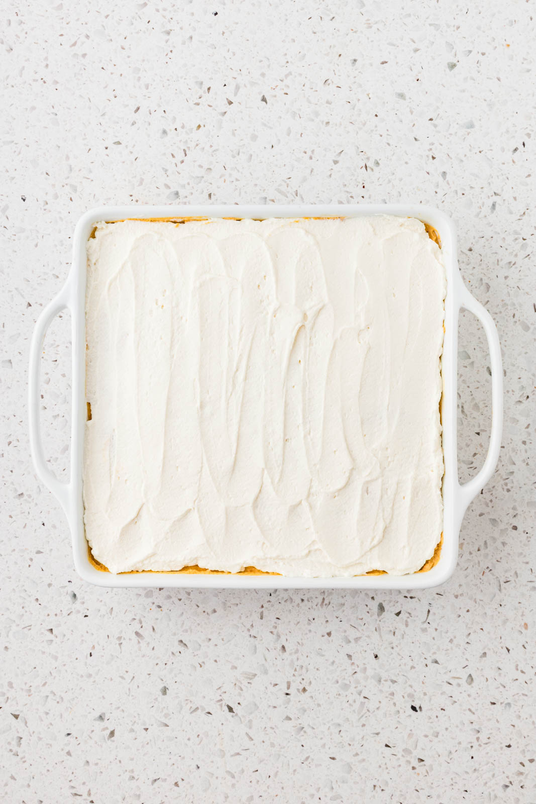 Tiramisu topped with whipped cream